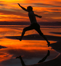 person at sunset on shi shi beach in washington